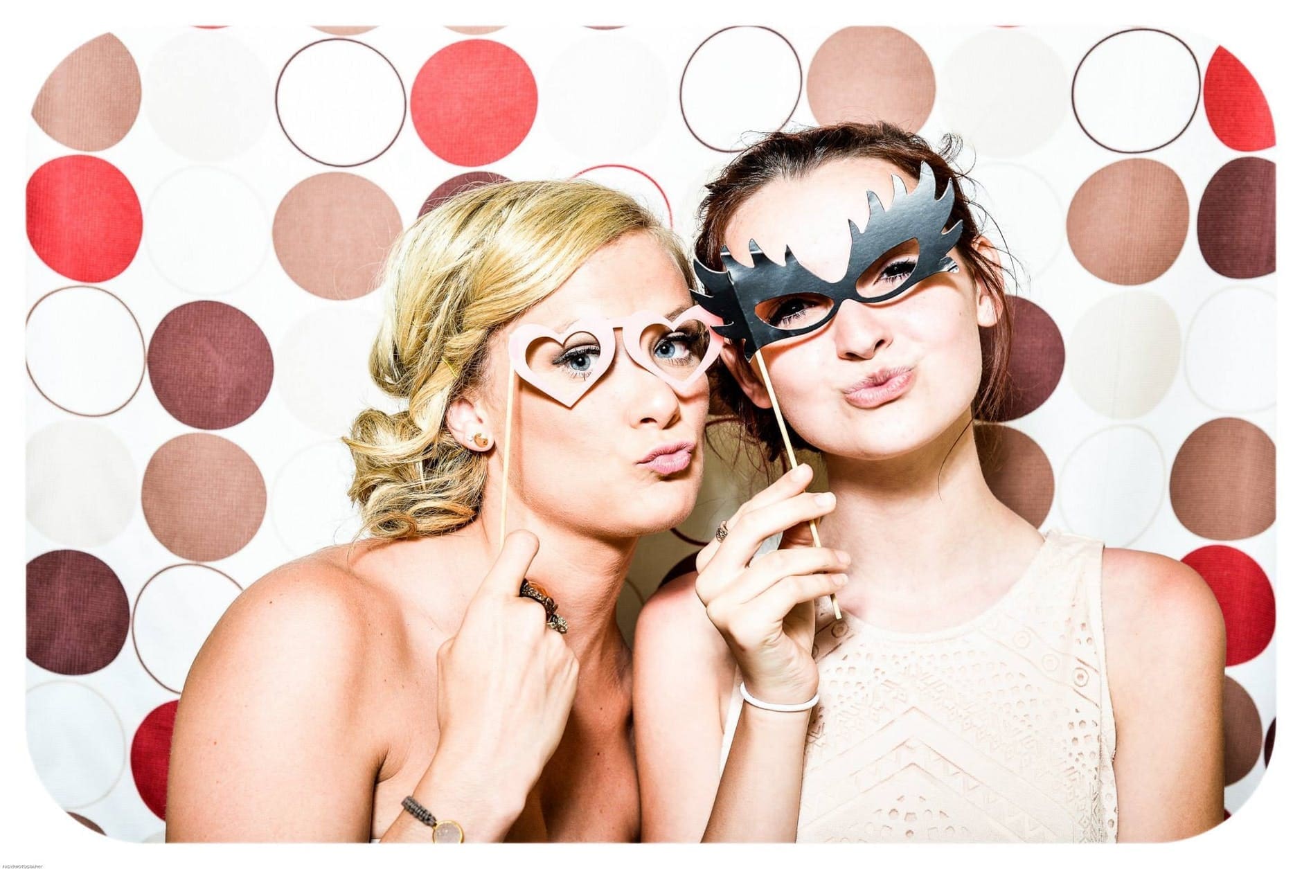 two person inside a photo booth two person inside a photo booth